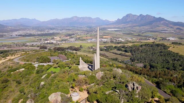 Proud Afrikaanse Taalmonument perched atop Paarl mountain, rotating aerial