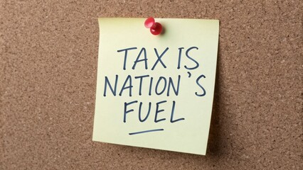 Tax Is Nation's Fuel Concept on Sticky Note Against Cork Background Symbolizing Government Revenue and Economic Growth