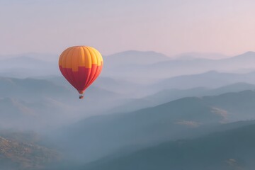 Fototapeta premium Hot air balloon flying over a mountain range