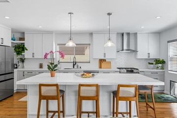 Modern living room with flat-screen TV, fireplace, and minimalist decor in natural light
