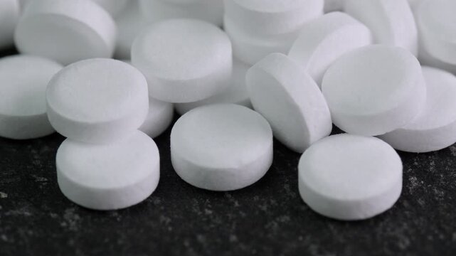Sugar substitute pills rotating in close up. Artificial sweetener tablets zero calories