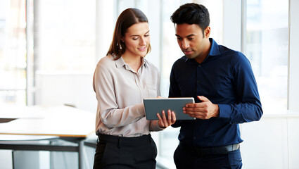 Colleagues collaborating using tablet device in office business people