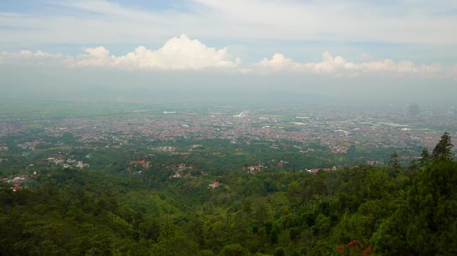 The view of Bandung City from the peak of Batu Kuda Hill on Mount Manglayang.