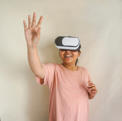 Young Asian Female With VR Device Touches Air. Studio Shot