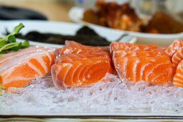salmon sashimi slices with wasabi