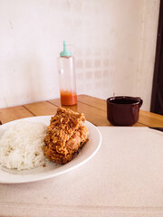 Fried Crispy Chicken with Steamed White Rice on Plate