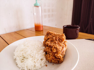 Fried Crispy Chicken with Steamed White Rice on Plate