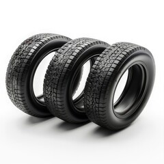 Three black tires with varying tread patterns arranged in a row.