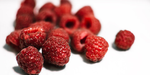 raspberries on white background