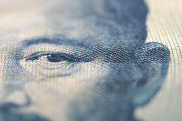Close-Up View of Eye on Currency with Intricate Detail and Texture