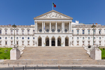 Fototapeta premium A frontal view of the grand steps leading up to the Assembly of the Republic in Lisbon. The building's neoclassical architecture and entrance are on full display. Lisbon, Portugal. 1 August 2025.