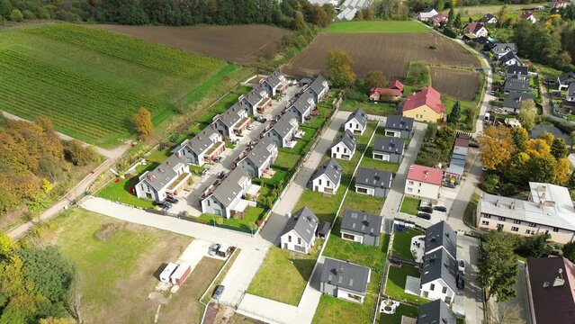 Neighborhood of suburban homes next to farmlands