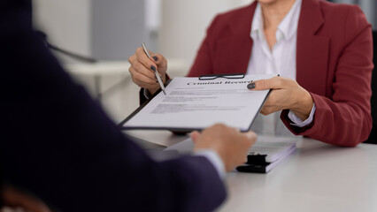 Experienced lawyer adult giving criminal record legal document client at law office for critical...