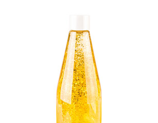 Elegant Glass Bottle of Shimmering Golden Liquid on White Background 