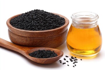 Black Seeds and Honey in Wooden Bowl and Spoon