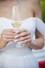 bride and groom holding champagne glasses