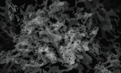 Abstract gray blob shape with irregular edges on a black background creating a unique design element