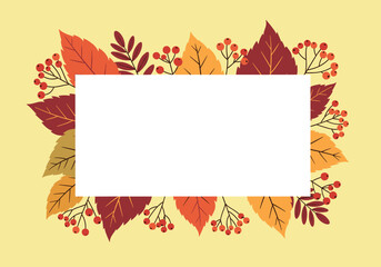 Fototapeta premium Warm autumn leaves and berries frame a blank white rectangular space.
