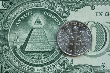 American cent coin on dollar bill close up. United States currency