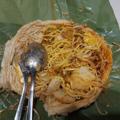 Toge Goreng (fried bean sprouts) is a traditional Indonesian street food of stir-fried bean sprouts served with rice cake, yellow noodles, and savory-sweet peanut and soy sauce