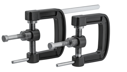 Close-up of two black metal clamps