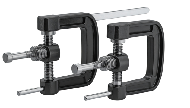 Close-up of two black metal clamps