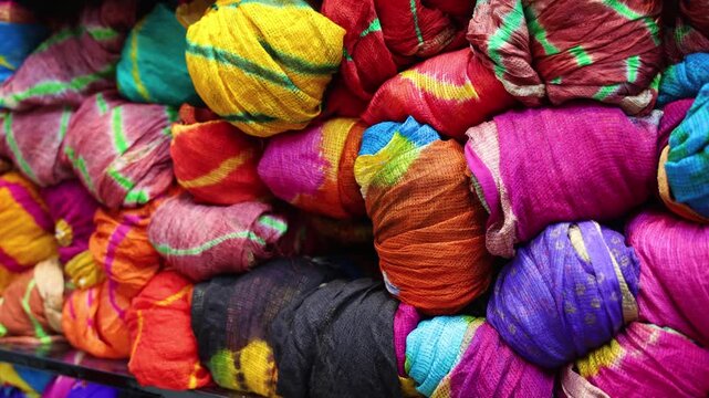 colorful rajasthani traditional bandhani saree collection displayed at retail shop