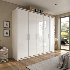 A modern bedroom featuring a large white wardrobe with sleek handles. The room has wooden flooring and a cozy atmosphere with natural light coming through the windows.