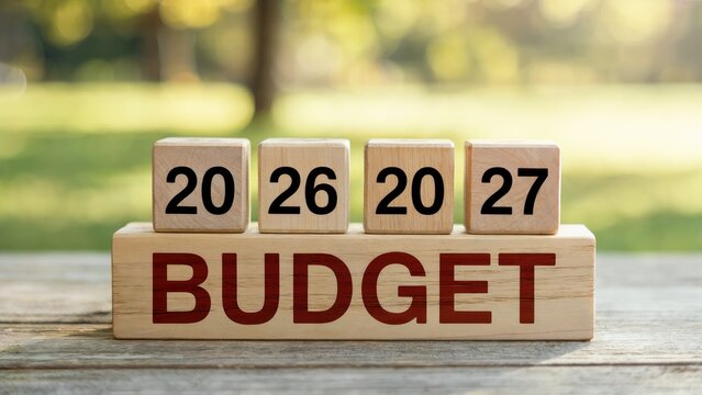 Planning future budgets with blocks showing 2026 and 2027, conceptualizing financial strategy outdoors - Powered by Adobe