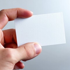 Hand Holding Blank Textured White Card