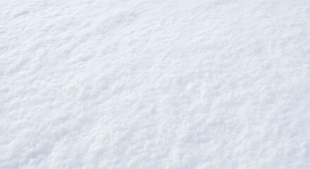 Fototapeta premium Close-up of freshly fallen snow showing its soft texture and crystalline structure, perfect for winter backgrounds and design elements