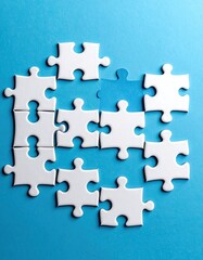 White jigsaw puzzle pieces on a light blue background, some assembled and one missing piece