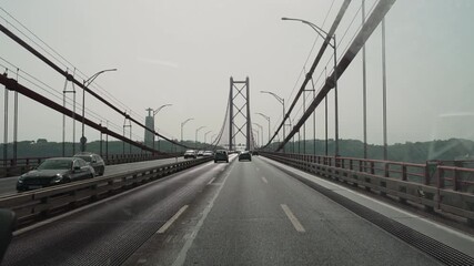traffic crossing the april 25th bridge in Lisbon.