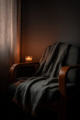 old cozy armchair is positioned beside large window draped with soft warm blanket creating serene atmosphere
