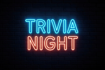 Obraz premium Blue and Red Neon Sign Reads TRIVIA NIGHT Against Dark Brick Wall trivia night