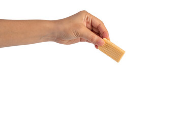 Wafer biscuit with chocolate cream and hand isolated on transparent background