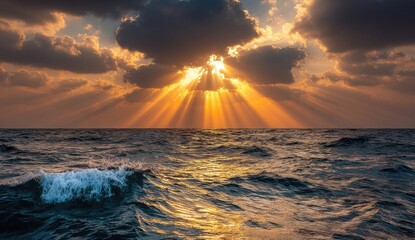 Golden sunbeams pierce stormy clouds over a restless sea