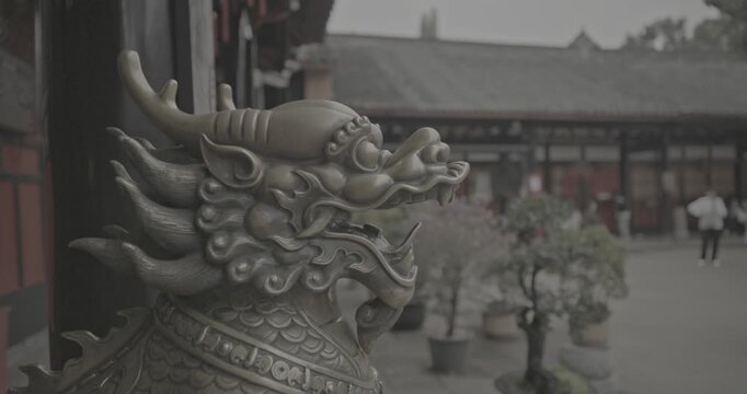 Chengdu, Sichuan, China. Ungraded C LOG 2, Bronze Lion head sculpture. Statue of mystical Chinese guardian lion. Head of golden Lion statue at Wenshu monastery. Sculptures Of Kylins Or Qilin. Kylins
