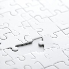 Close-up of white jigsaw puzzle with missing piece