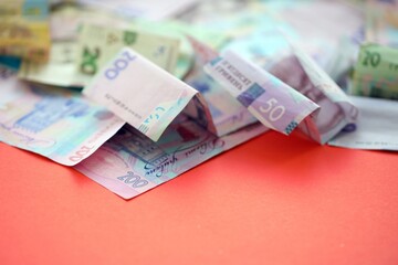 Big amount of Ukrainian hryvnia money bills. Pile of crumpled ukrainian banknotes