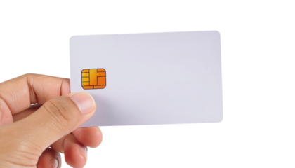 Hand holds blank white smart card with visible chip on transparent background ideal for business use in PNG format