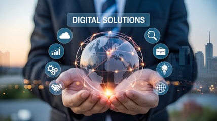 Hands holding glowing transparent globe with blue digital business icons and “DIGITAL SOLUTIONS” label over modern city skyline at sunset