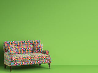 Classic sofa in multicolor patches fabric on green background with copy space
