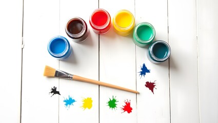 WHITE wooden table , colorfull jar and paint brush arial view
