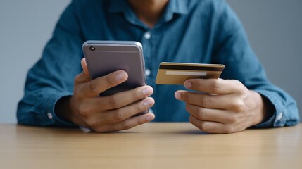 A man with East Asian descent engages in digital alchemy, balancing smartphone and credit card, Cyber Monday fervor