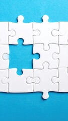 White puzzle pieces on a light-blue background with a missing piece