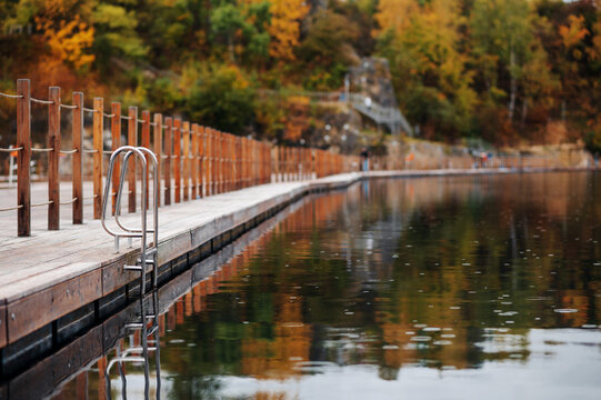 Zakrz&oacute;wek Quarry, Krakow. Floating swimming pool. Cloudy autumn day
