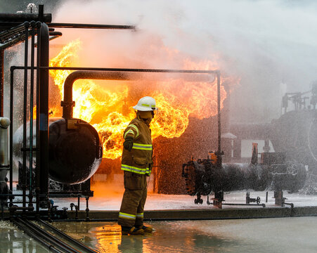 Firefighters practice in a refinery