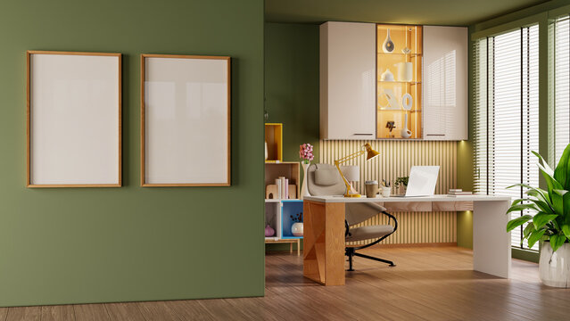 Mockup poster frame,Modern home office interior with green wall and wooden desk- 3D rendering