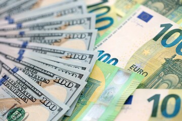 Big pile of Euro and USD banknotes. Many european and united states dollars
